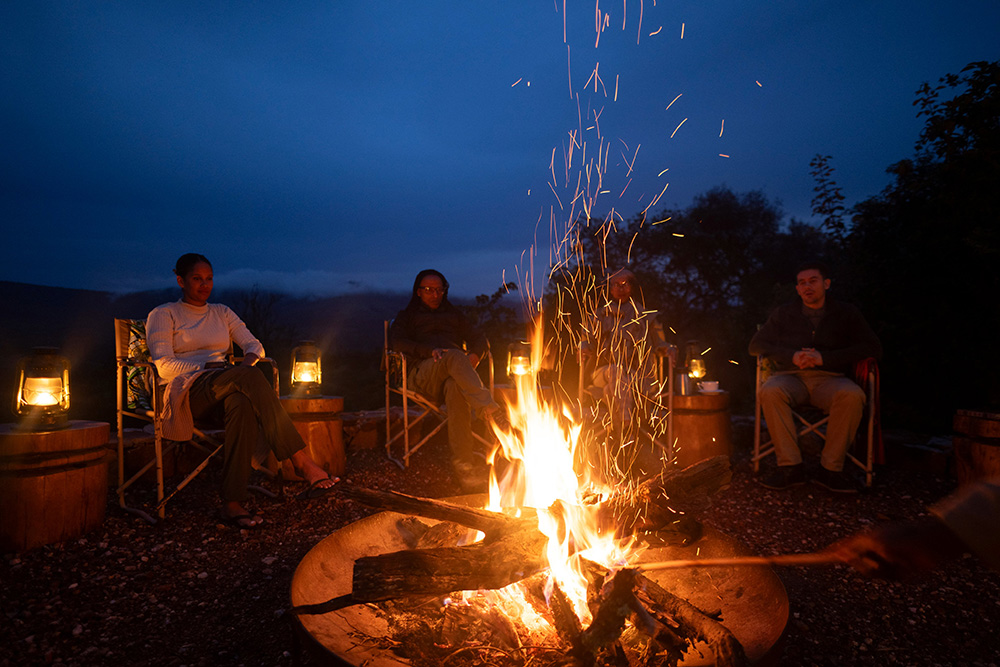 Guests on a camp fire in Akagera